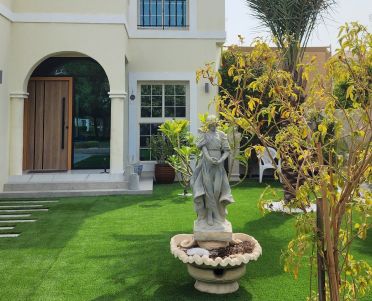 Villa entrance with a lawn, stepping stones, a statue fountain and planting, Project Beyond, Dubailand