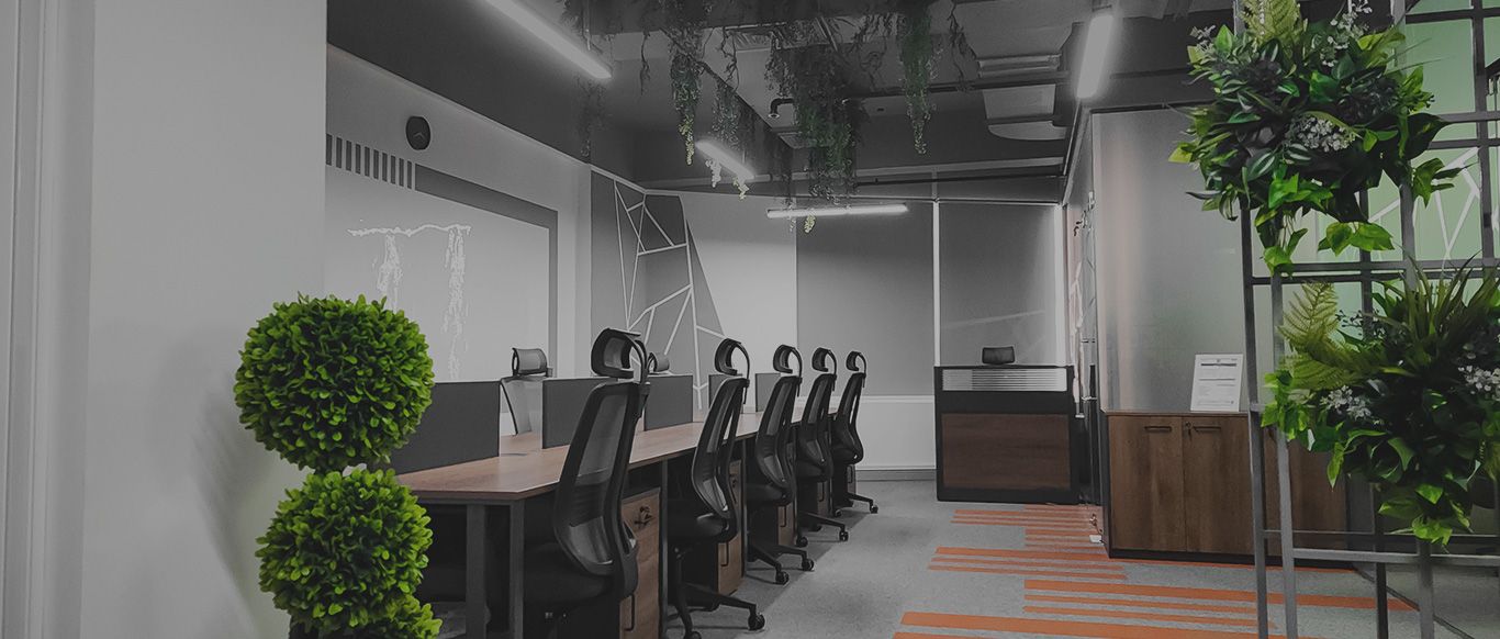 Fitted-out open-plan office with an exposed ceiling, workstations, plants and glass meeting rooms, Project Design, Dubai Silicon Oasis