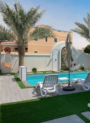Pool with sun loungers and a hanging egg chair under a palm, Project Jewel, The Villa