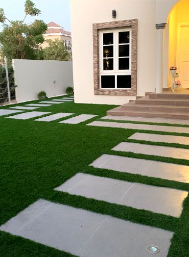 Lawn with stepping stones in front of the villa at Project Jewel, The Villa
